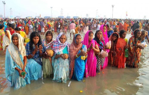 Devotees perform rituals at the Gangasagar island, some 160 km south of Kolkata, on `Makar Sankranti` on Jan 14, 2015. 