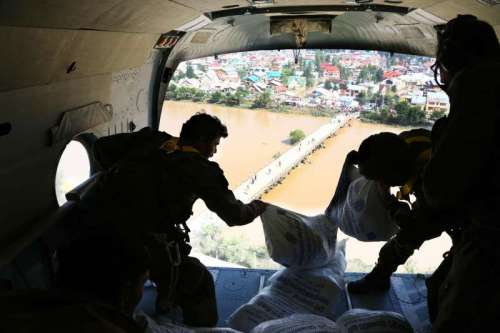 Armed forces personnel drop therapeutic food packets in the flood affected areas of Srinagar 