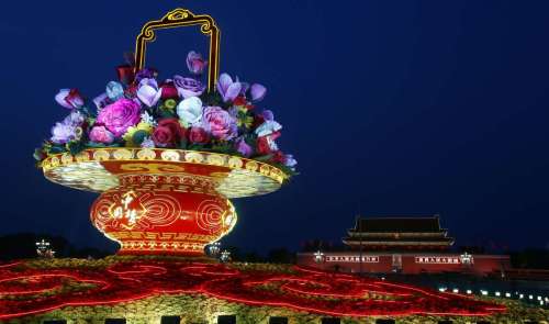 A huge parterre, which is set up to celebrate China's National Day on Oct. 1, is illuminated at the Tian'anmen Square in Beijing, China