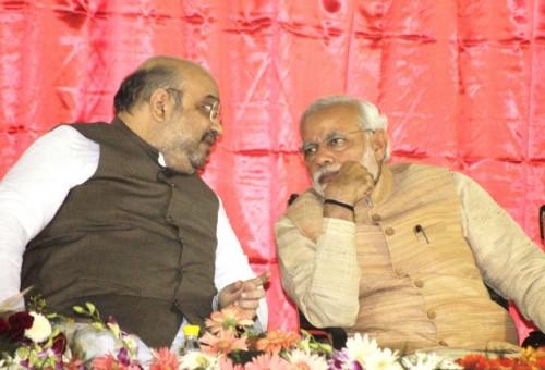 New Delhi: Prime MInister Narendra Modi with BJP president Amit Shah during the launch of BJP membership drive at party headquarters in New Delhi on Nov. 1, 2014. (Photo: Sunil Majumdar/IANS)