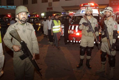  Pakistani paramilitary troops stand guard outside a hospital in eastern Pakistan's Lahore, Nov. 2, 2014. At least 55 people were killed and 118 others injured in a suicide blast that took place near Wagah crossing point at Pak-India border in Pakistan's eastern city of Lahore on Sunday evening, police officials said. 