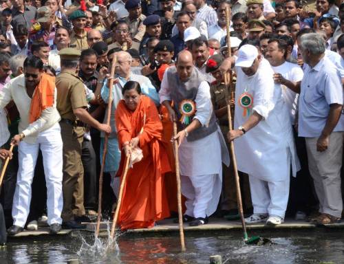 Union Home Minister Rajnath Singh, Union Minister for Water Resources, River Development and Ganga Rejuvenation Uma Bharati and others clean the Gomti river during a clean Gomti campaign in Lucknow