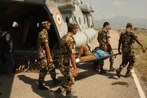 Soldiers take away an injured for treatment in earthquake hit Nepal on May 31, 2015