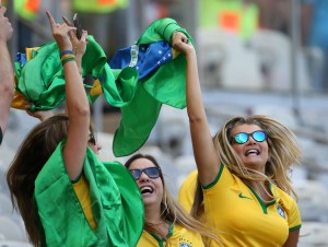 Brazil's fans pose before a Round of 16 match between Brazil and Chile of 2014 FIFA World Cup at the Estadio Mineirao Stadium in Belo Horizonte, Brazil