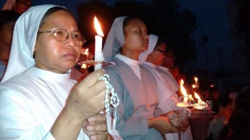 Nuns participate in a candlelight vigil to condemn the gang-rape of a nun in Ranaghat of West Bengal, in Agartala on March 20, 2015. 