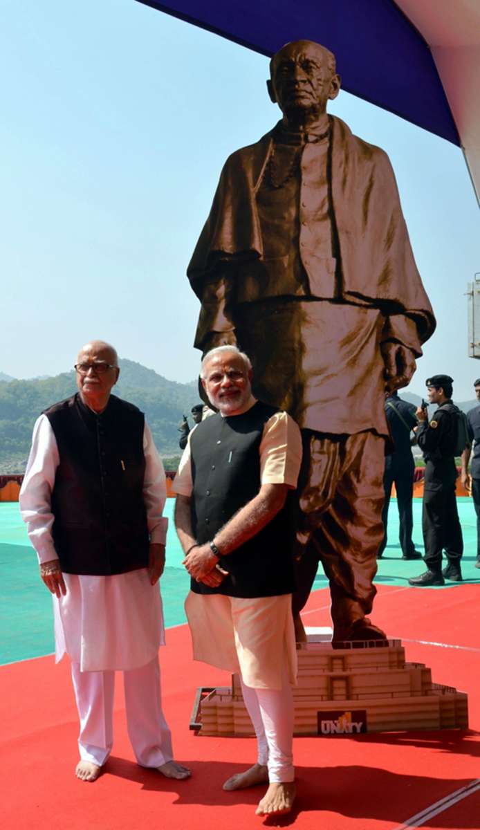 Senior BJP (Bharatiya Janata Party) leader L K Advani with BJP Prime Ministerial candidate and Gujarat Chief Minister Narendra Modi during the foundation stone laying ceremony for Sardar Patel's statue of Unity at Kevadia colony near Sardar Sarovar Dam on Oct.31, 2013. (Photo: IANS)