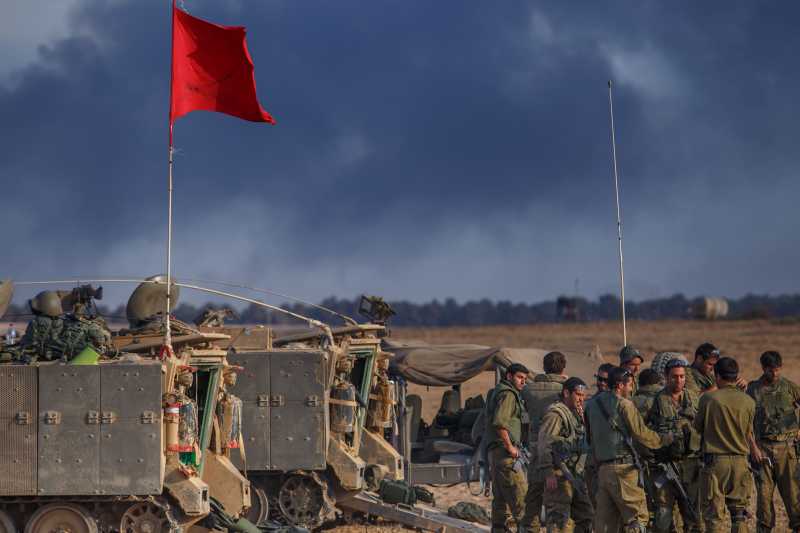 GAZA BORDER: Israeli soldiers are seen at an army deployment area in southern Israel near the border with Gaza