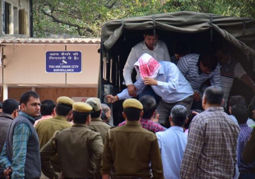 The five people arrested by the Delhi Police for stealing documents and leaking them to corporate houses being taken to be produced before a Metropolitan Megistrate`s court in New Delhi, on Feb 21, 2015. The arrested people include two employees of the petroleum ministry. 