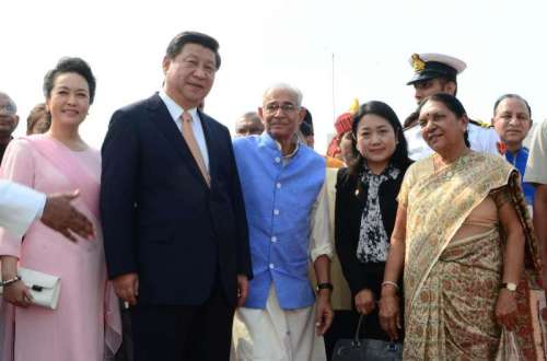 (L-R) First Lady of the Republic of China, Peng Liyuan, Chinese President Xi Jinping, Gujarat Governor O.P. Kohli and Gujarat Chief Minister Anandiben Patel (R) at Sardar Patel International Airport in Ahmedabad, Gujarat on Sept 17, 2014. (Photo: IANS)