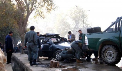 Afghan security forces inspect the site of blast in Kabul