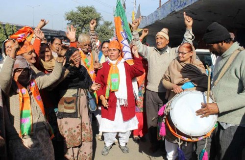 Refugees from Pakistan occupied Kashmir (PoK) celebrate BJP's performance in the recently concluded Jammu and Kashmir assembly polls in Jammu on Dec 24, 2014.