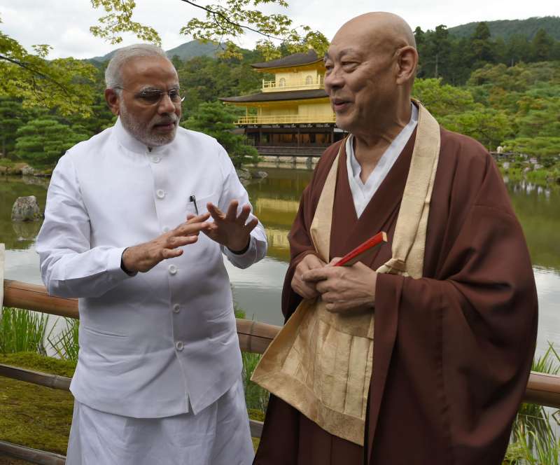 Prime Minister Narendra Modi interacts with the head priest of the Kinkaku-ji (Golden Pavilion) Temple during his visit to the temple in Kyoto, Japan on August 31, 2014. (Photo: IANS/PIB)