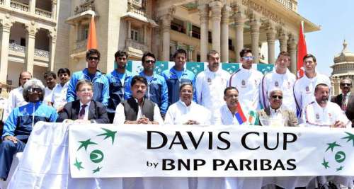 Karnataka Chief Minister Siddaramaiah with Indian tennis coach Vijay Amritraj, Indian tennis players Somdev Devvarman, Rohan Bopanna, Leander Paes, Yuki Bhambri and others during the draw ceremony of Davis Cup - 2014 at the Vidhan Soudha in Bangalore