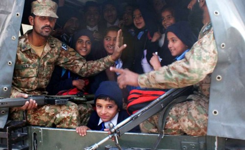 Pakistani soldiers transport rescued school children from the site of an attack by Taliban gunmen on a school in northwest Pakistan's Peshawar on Dec. 16, 2014. The death toll of a terror attack on a school in Peshawar of Pakistan's northwest Khyber Pakhtunkhwa 