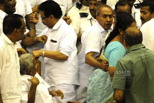 Kerala legislators go berserk in the state assembly during the budget session in Thiruvananthapuram on March 13, 2015. 