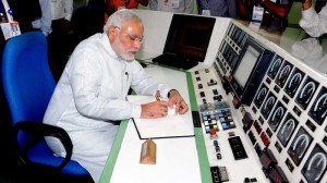 The Prime Minister, Shri Narendra Modi signing the visitors book, during his visit at the Bhabha Atomic Research Centre (BARC), in Mumbai on July 21, 2014.