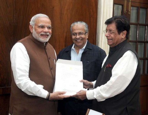 The Member of Parliament and President of the Indian Union Muslim League, Shri E. Ahamed presenting a cheque for Rs 25 lakh rupees to the Prime Minister, Shri Narendra Modi, towards the Prime Minister's National Relief Fund, for flood relief and rehabilitation. The Indian Union Muslim League has extended all support for the Prime Minister's relief activities, in New Delhi on December 03, 2014.