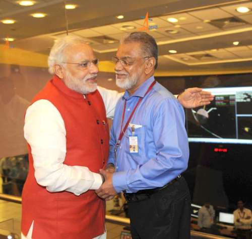 The Prime Minister, Shri Narendra Modi congratulating the ISRO Chairman, Dr. K Radhakrishnan after successful Insertion of Mars Orbiter (Mangalyan) into the Mars orbit, at ISRO Headquarters, in Bengaluru. FILE PHOTO 