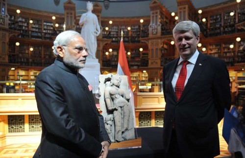 Prime Minister Stephen Harper of Canada returning artefact 'Parrot lady' to Indian Prime Minister Narendra Modi