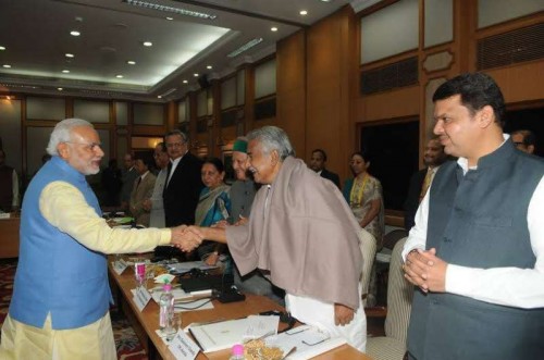 Modi greets Chandy,during the meeting of Chief Minister's to discuss the future of Planning in India at the Prime Minister's Residence.