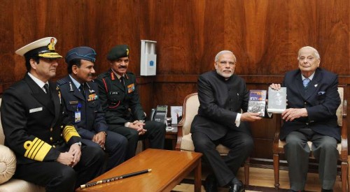 The Lt. General (Retd.) JFR Jacob presenting his book "An Odyssey in War & Peace" and "Surrender at Dacca" to the Prime Minister, Shri Narendra Modi, in New Delhi on December 16, 2014. The Chief of Army Staff, General Dalbir Singh, the Chief of Naval Staff, Admiral R.K. Dhowan and the Chief of the Air Staff, Air Chief Marshal Arup Raha are also seen.