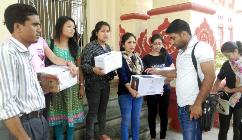 Nepali students of Banaras Hindu University (BHU) collect donations for the victims of Nepal earthquake outside the campus in Varanasi 