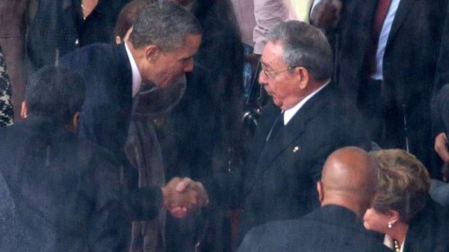 THE HANDSHAKE THAT BEGAN IT ALL: Obama shakes the hands of President Raul Castro at the funeral of Mandela in South Africa last year.