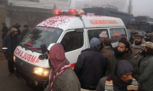 An ambulance, carrying the body of an executed prisoner and pictured with rose petals 