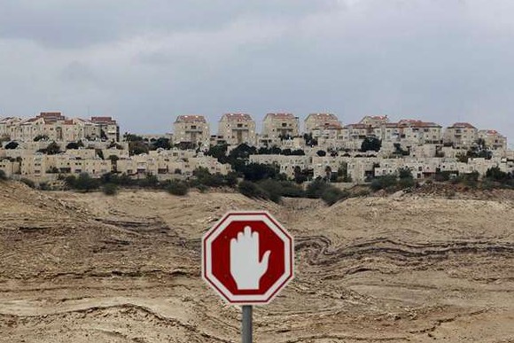 A stop sign is seen outside the West Bank Jewish settlement 