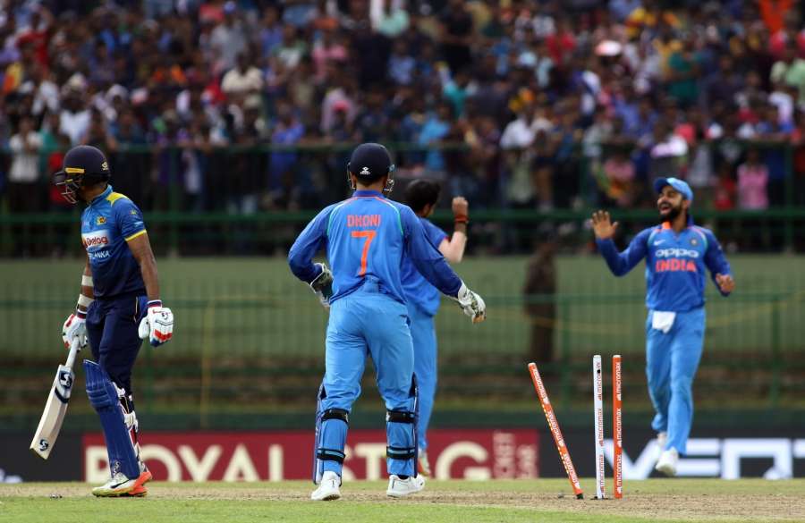 Pallekele: India's wicket keeper Mahendra Singh Dhoni breaks the stumps to dismiss Sri Lanka's Danushka Gunathilaka during the 2nd ODI match between India and Sri Lanka in Pallekele, Sri Lanka on Aug 24, 2017. (Photo: Surjeet Yadav/IANS) by . 