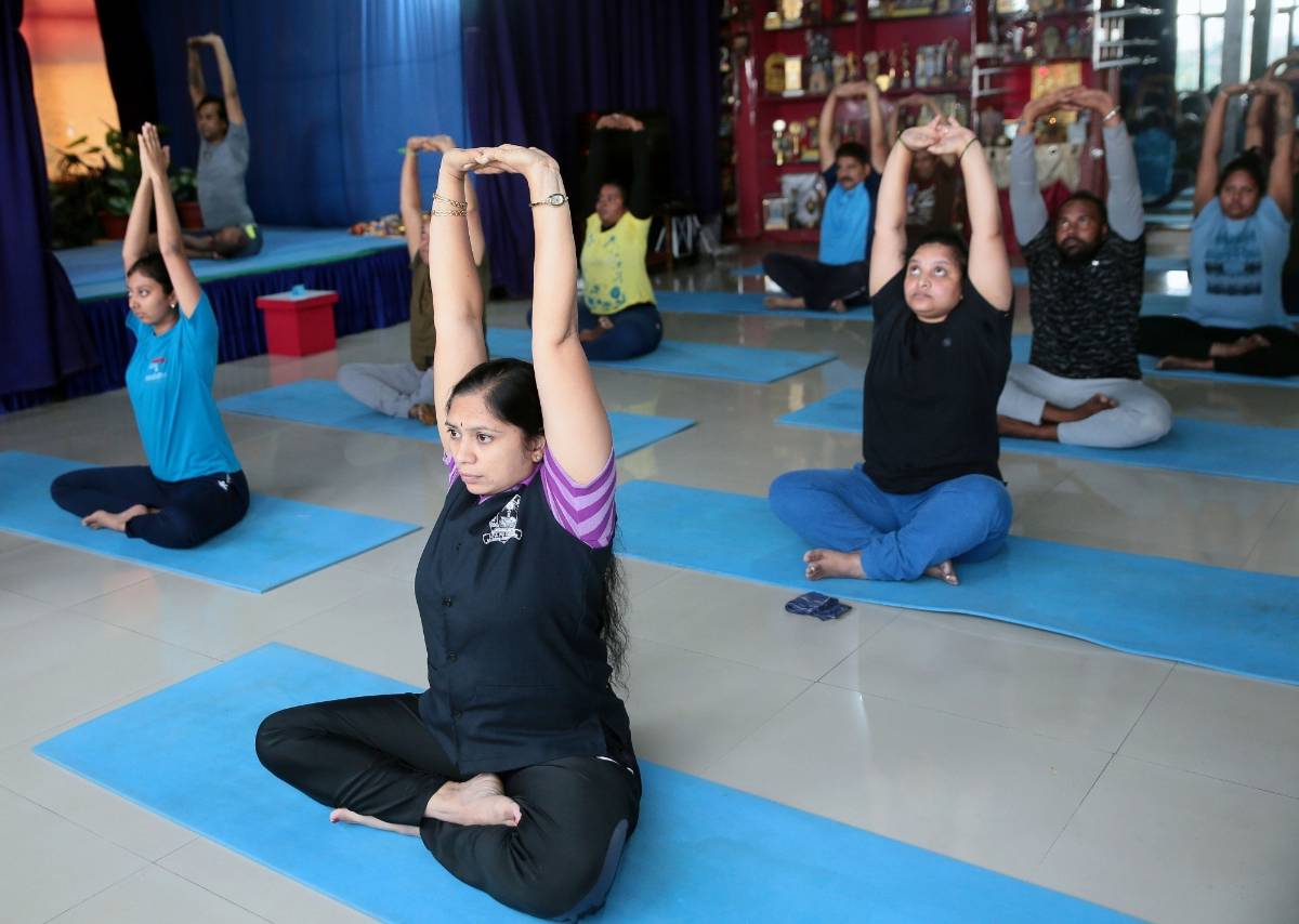 Bengaluru: People perform yogic asanas at SGS International Yoga Foundation centre after yoga centres and gyms re-opened as a part of the third phase of easing of COVID-19 lockdown, in Bengaluru on Aug 5, 2020. (Photo: IANS) by . 