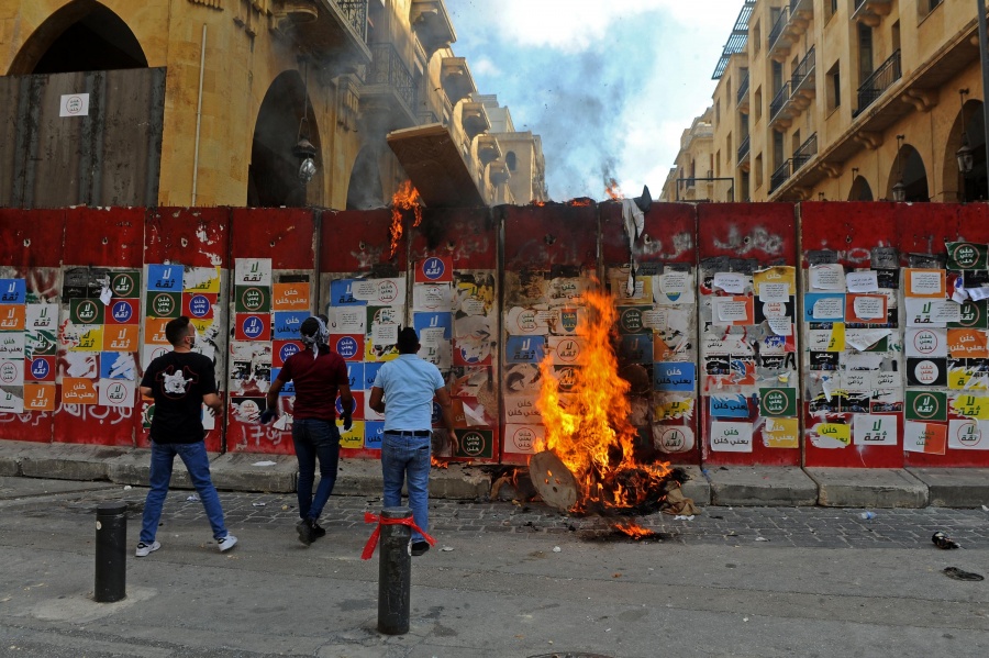 Beirut, Aug. 8, 2020 (Xinhua) -- Protesters try to storm the parliament building in downtown Beirut, Lebanon, on Aug. 8, 2020. A Lebanese police officer was killed and 142 people were injured on Saturday in clashes during protests against the ruling class in downtown Beirut, days after massive explosions rocked the Lebanese capital that killed at least 158 and injured 6,000 others, LBCI TV channel reported. (Photo by Bilal Jawich/Xinhua/IANS) by . 