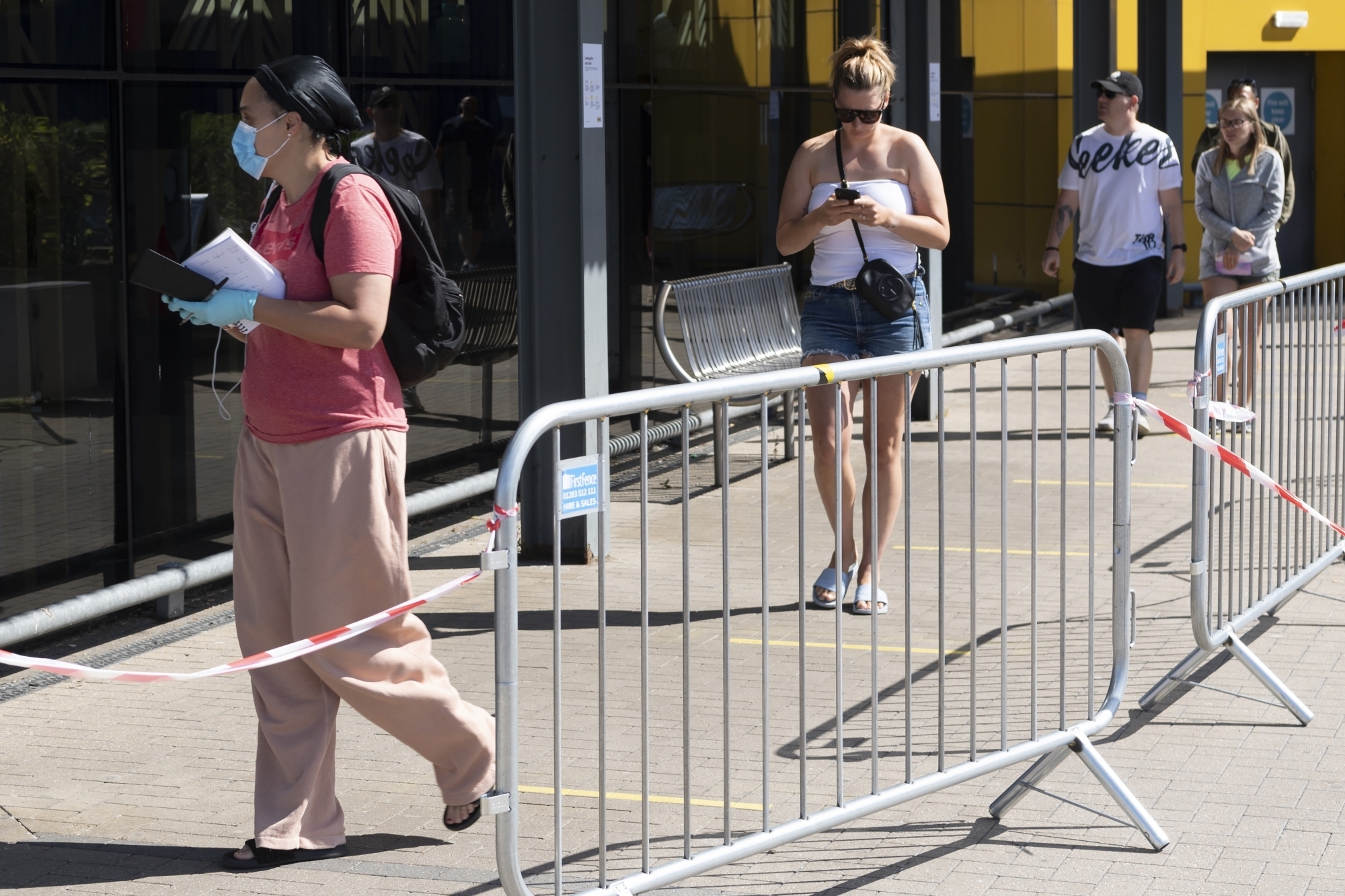 Customers keep social distancing whilst queuing up outside the IKEA store in Wembley, London, Britain (Xinhua/ IANS) by . 