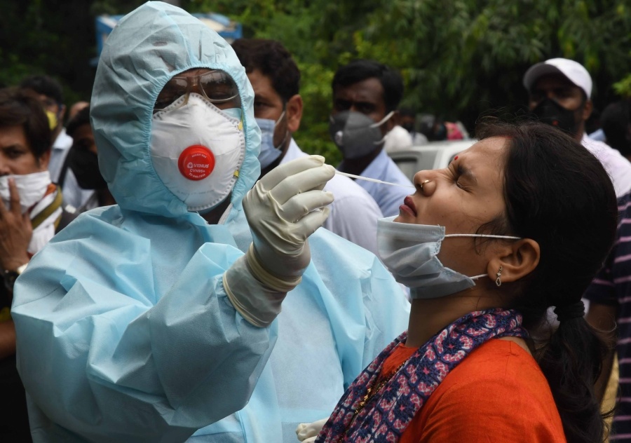 Patna: A health worker collects swab samples for COVID-19 testing outside Hotel Patliputra Ashok in Patna on July 29, 2020. (Photo: IANS) by . 